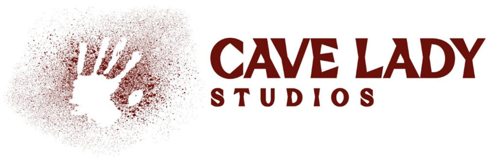 A hand print outlined in red ochre with the words Cave Lady Studios next to it